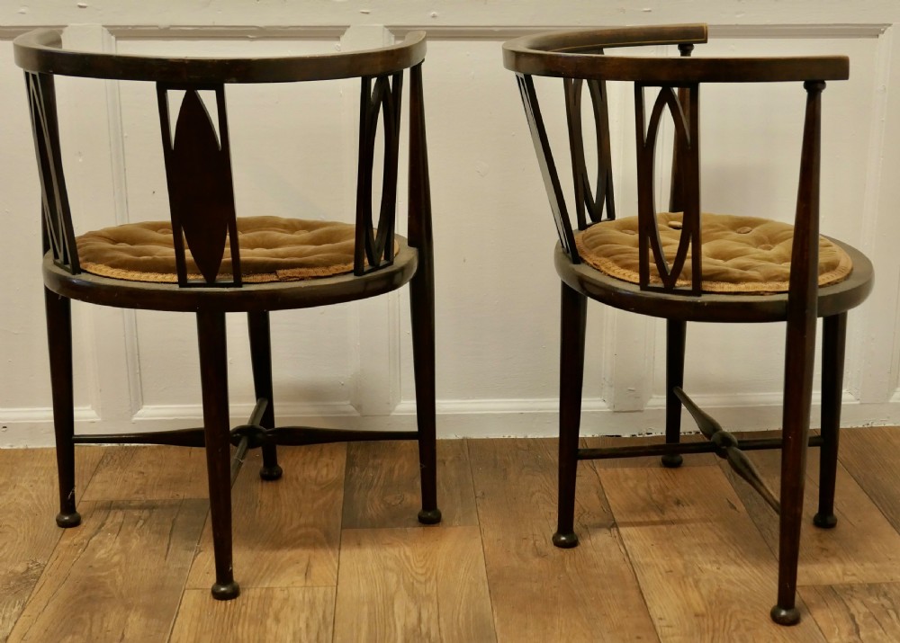 A pair of Edwardian Circular Arm Chairs View VII