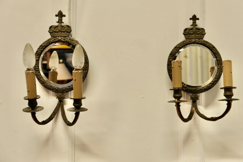 A Pair of Round Brass Girandole Wall Mirrors, in a Regal Design View IV