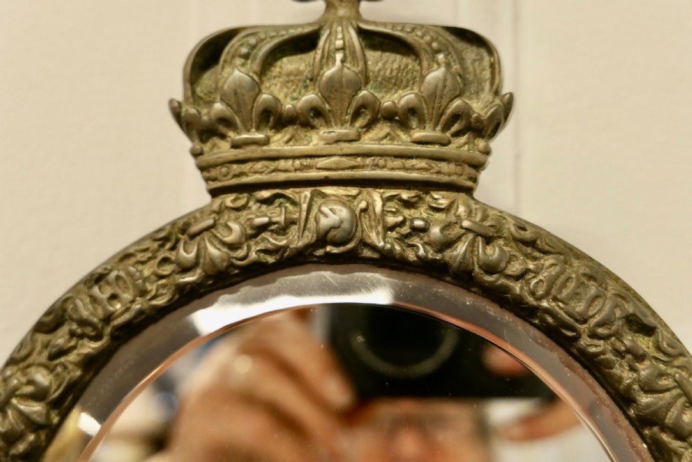 A Pair of Round Brass Girandole Wall Mirrors, in a Regal Design View V
