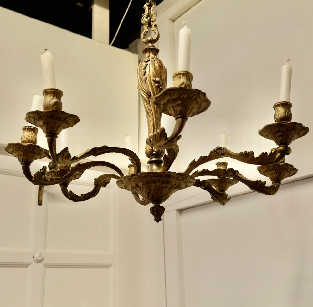 A French Gilded Brass 8 Branch Rococo Chandelier (Candelier)