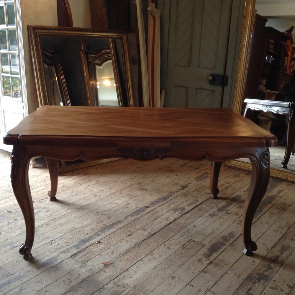 FRENCH WALNUT EXTENDING DINING TABLE