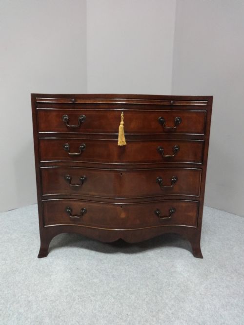 Great Serpentine Inlaid Mahogany Chest of Drawers