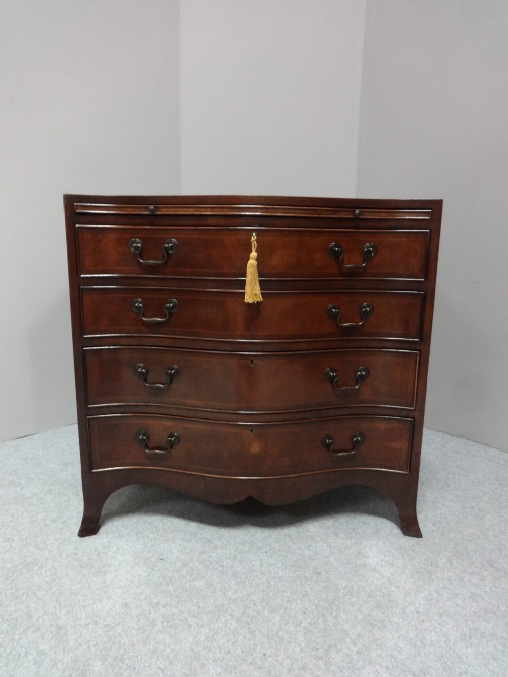 Great Serpentine Inlaid Mahogany Chest of Drawers