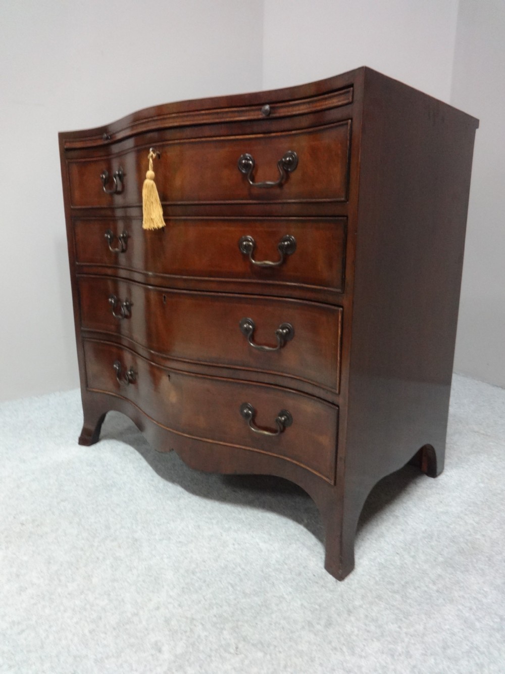 Great Serpentine Inlaid Mahogany Chest of Drawers View II