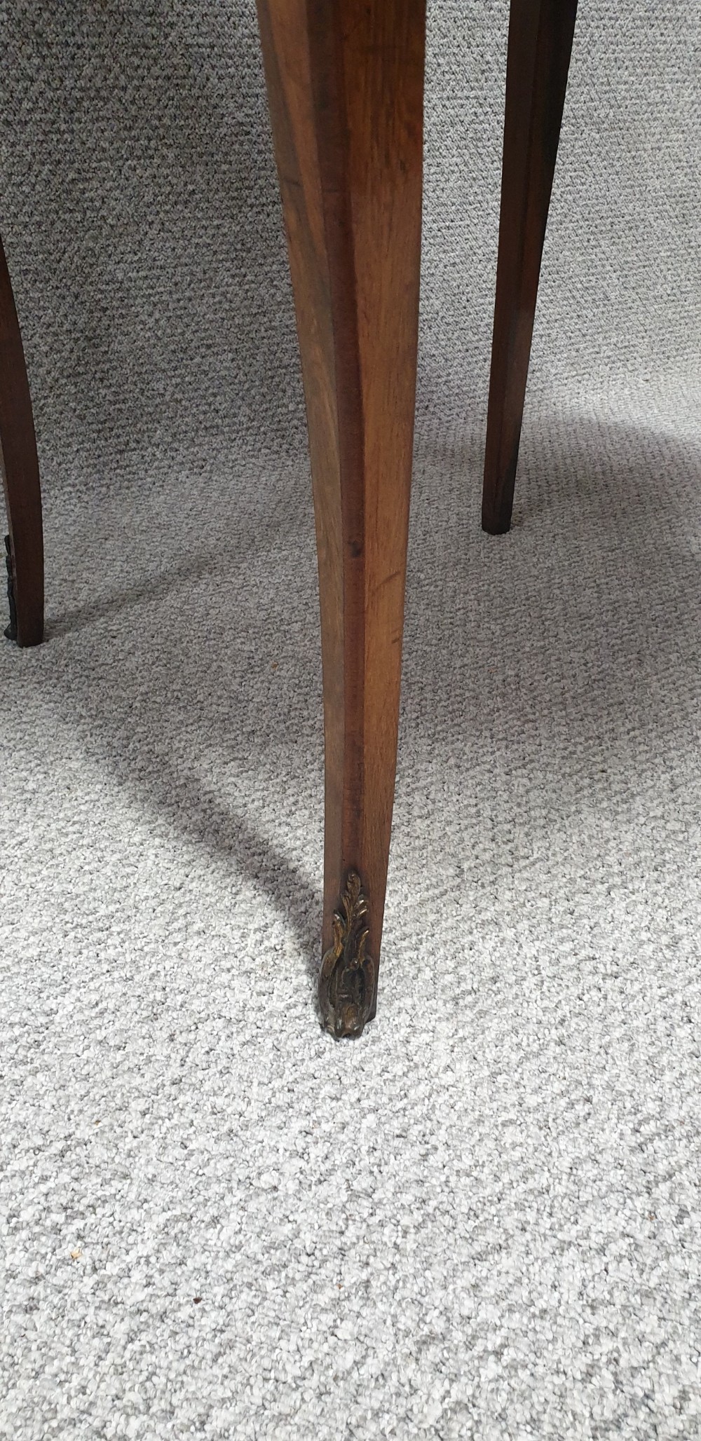A warm brown wooden drop-flap side table featuring floral marquetry inlay, slender cabriole legs, and brass foot mounts. View VII