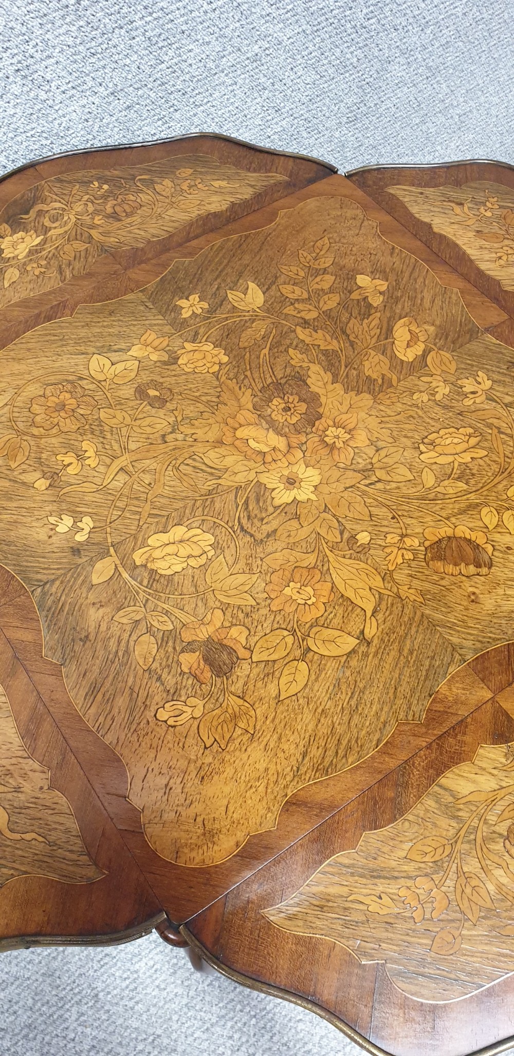 A warm brown wooden drop-flap side table featuring floral marquetry inlay, slender cabriole legs, and brass foot mounts. View VIII
