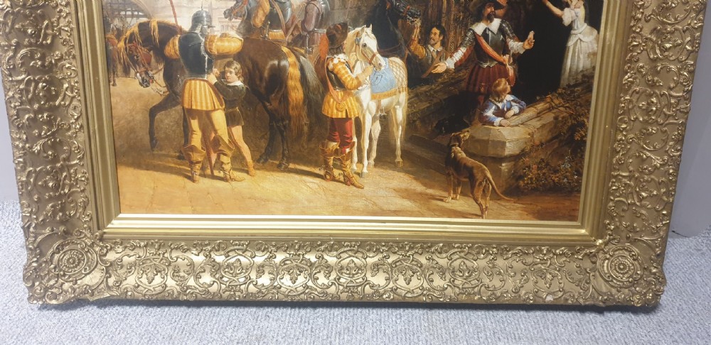 A large Victorian gilded picture frame with ornate relief moulding containing a historical narrative print. View V