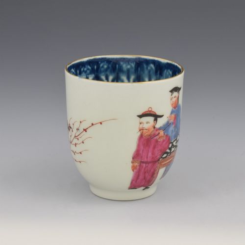 fig 1. An 18th-century white porcelain coffee cup decorated with hand-painted Chinese figures in red and blue enamel, featuring a single handle and an internal patterned rim.