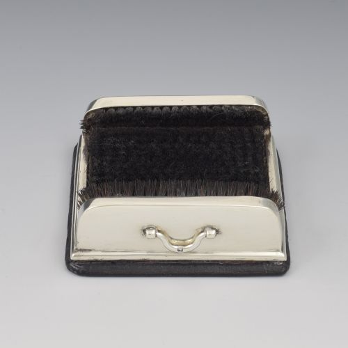 fig 1. An antique Victorian sterling silver novelty pen wipe in the form of a miniature boot scraper with black bristles.