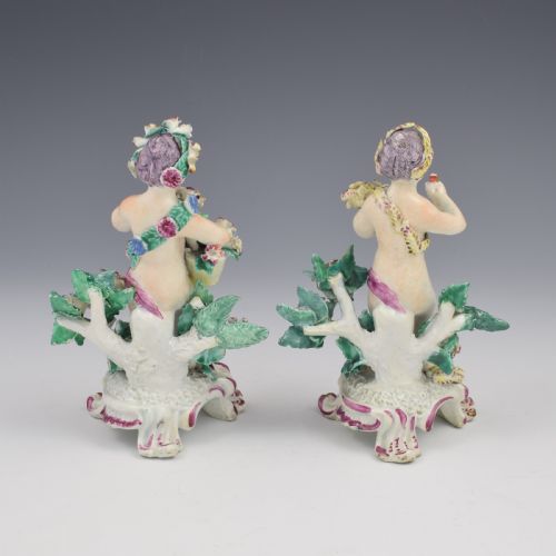 fig 3. A set of four 18th-century Bow soft-paste porcelain figures representing the seasons, depicting putti on rococo scroll bases with colourful floral bocage.