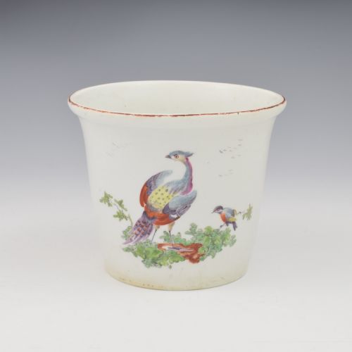 fig 1. An eighteenth-century white soft-paste porcelain flower pot and matching shallow stand, decorated with hand-painted polychrome birds and insects.