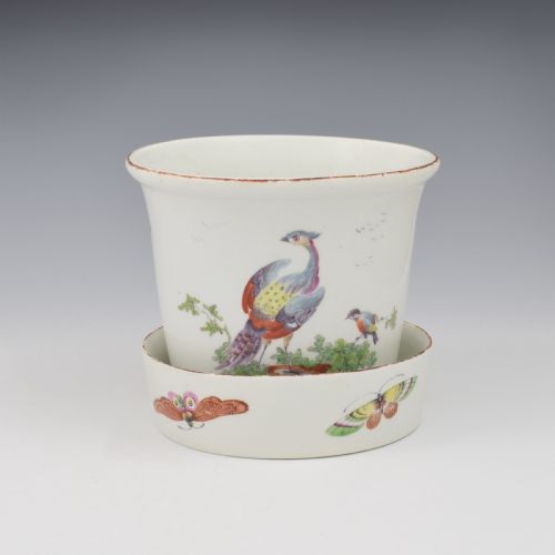 fig 2. An eighteenth-century white soft-paste porcelain flower pot and matching shallow stand, decorated with hand-painted polychrome birds and insects.