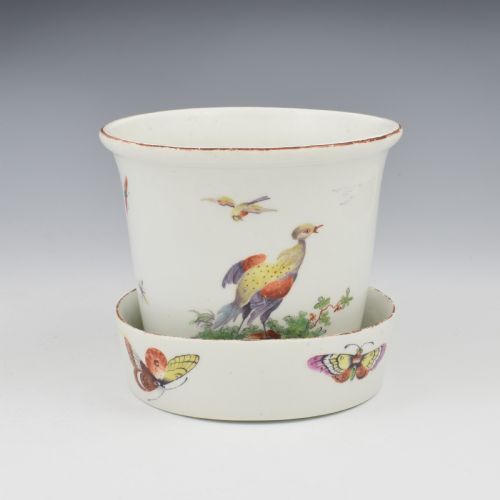 fig 3. An eighteenth-century white soft-paste porcelain flower pot and matching shallow stand, decorated with hand-painted polychrome birds and insects.
