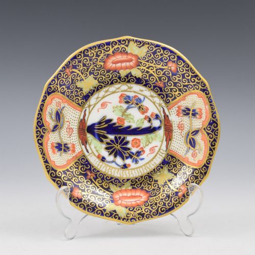fig 1. An Edwardian Royal Crown Derby porcelain coffee cup and matching saucer decorated in a rich cobalt blue, iron red, and gilt Imari pattern.