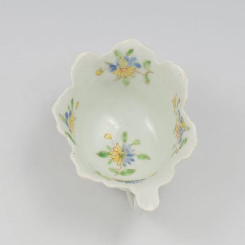 fig 2. An eighteenth-century Dr Wall First Period Worcester soft-paste porcelain butter boat featuring hand-painted polychrome floral enamel sprigs and a leaf-moulded rim.