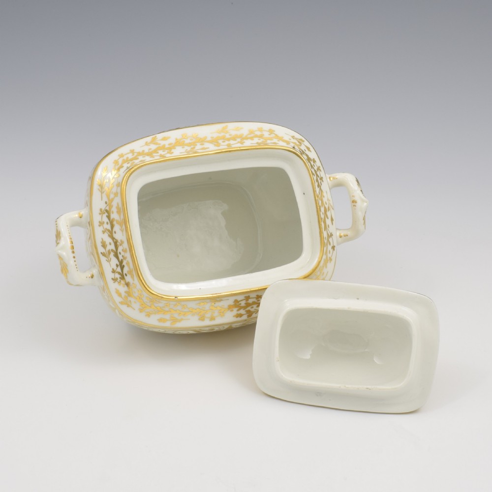A white and gold Regency Spode porcelain sugar box with original lid, featuring loop handles and Neoclassical gilt scroll patterning. View VIII