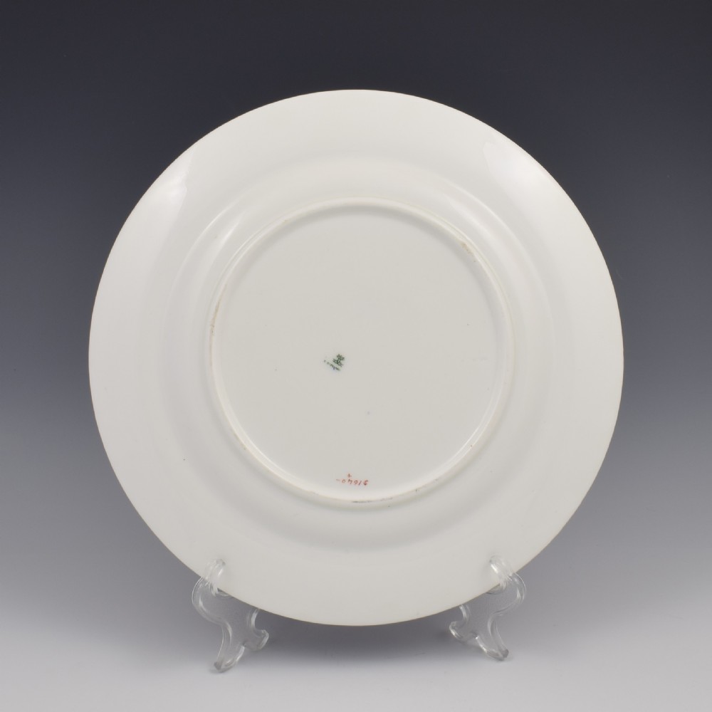 A Victorian Copeland porcelain cabinet plate featuring a bright cobalt blue border, gilt ornamentation, and a central heraldic coat of arms on a white ceramic ground. View III