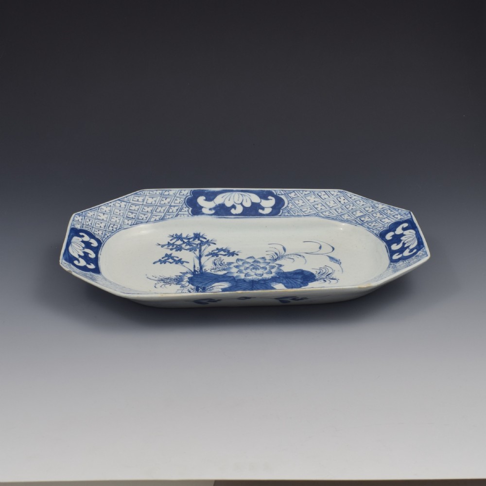 An 18th-century octagonal blue and white soft-paste porcelain serving dish decorated with a central lotus and bamboo design within a diaper border. View IV