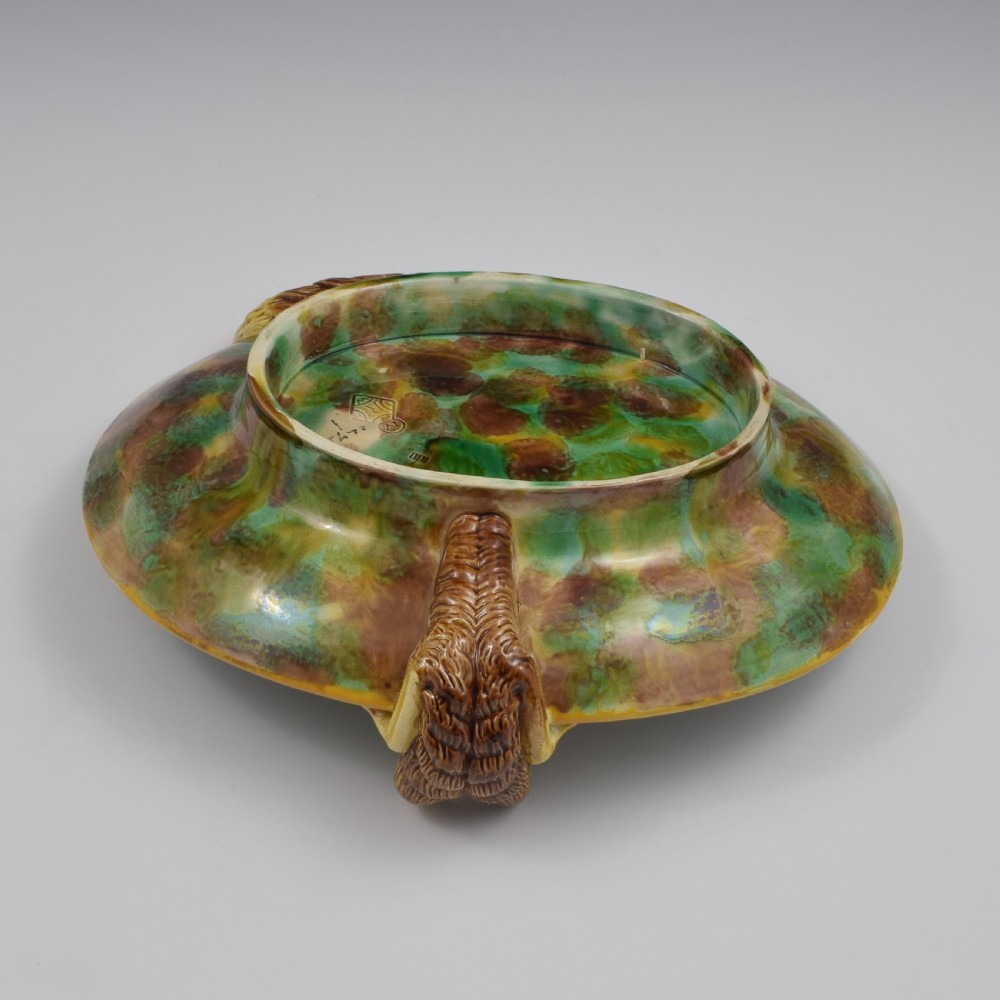 An oval Victorian majolica dish featuring a pink interior ground with raised green leaves and a sculpted fox head perched on the rim. View XIV