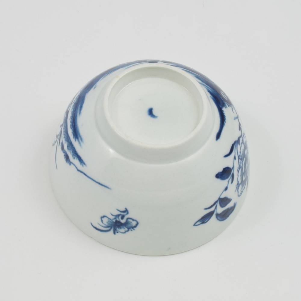 An 18th-century First Period Worcester soft-paste porcelain slop bowl decorated with the blue and white Candle Fence Chinoiserie pattern. View VII