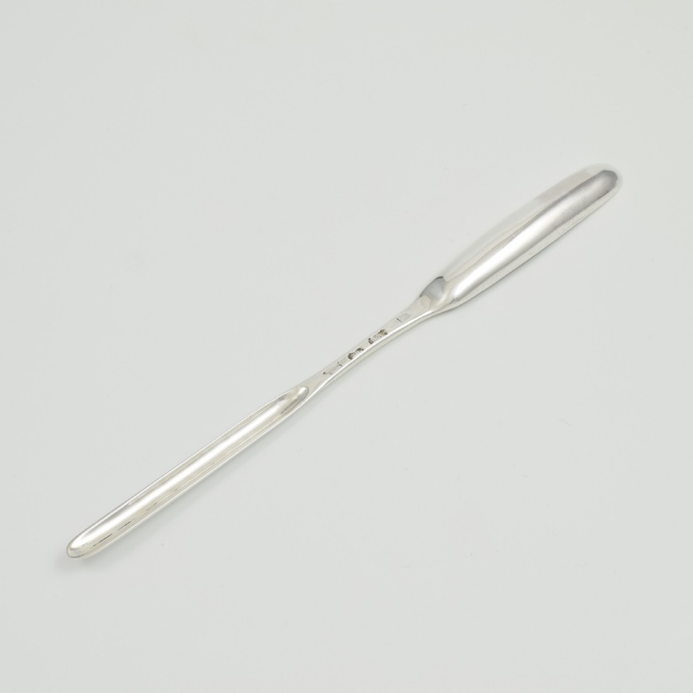 A George II sterling silver double-ended marrow scoop featuring a smooth polished surface and elongated spoon bowls. View II