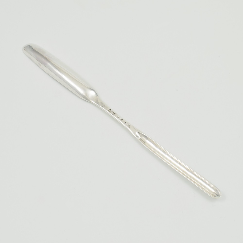 A George II sterling silver double-ended marrow scoop featuring a smooth polished surface and elongated spoon bowls. View IV