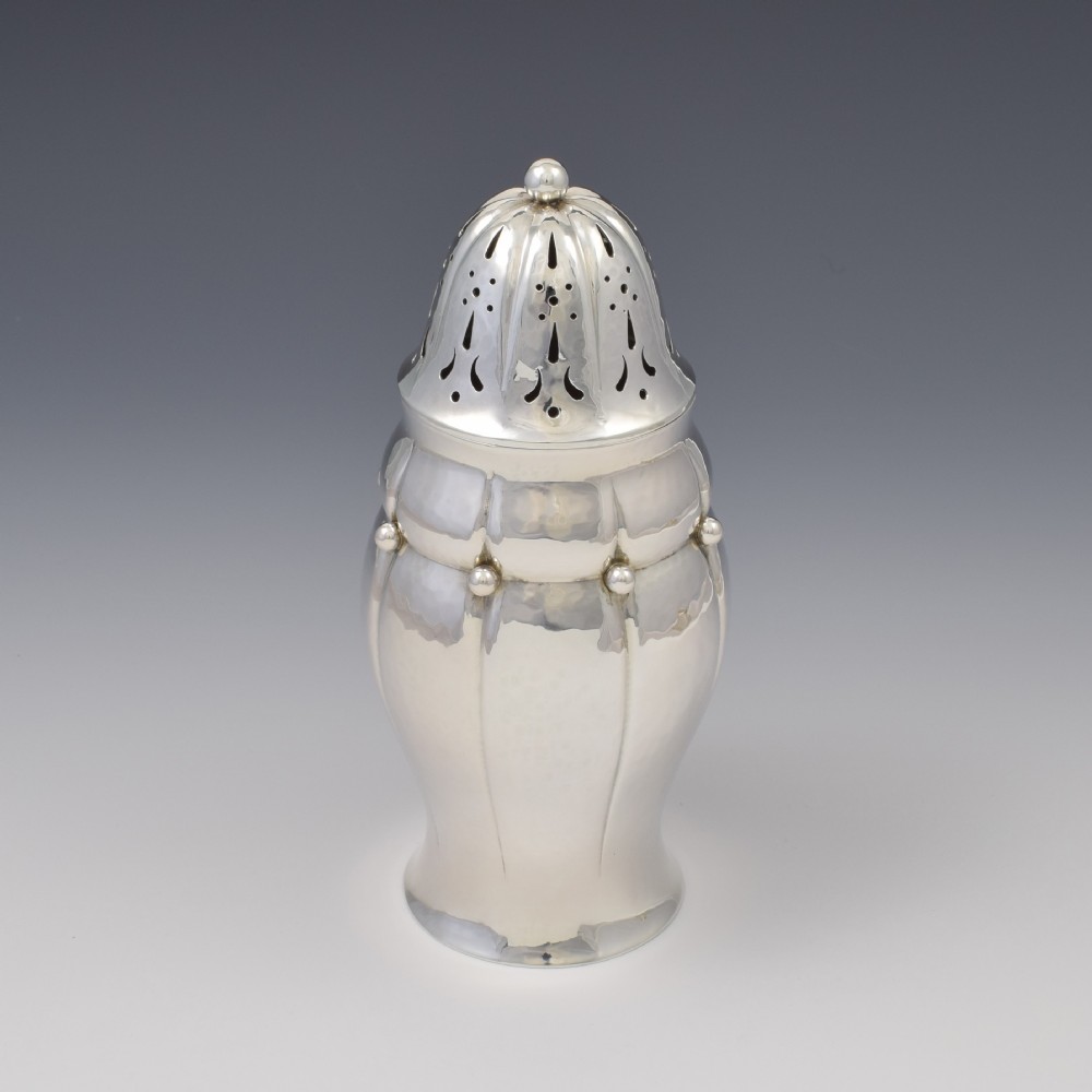 An Art Nouveau Danish sterling silver sugar caster featuring a lobed body with applied bead details and a hand-pierced domed cover. View II