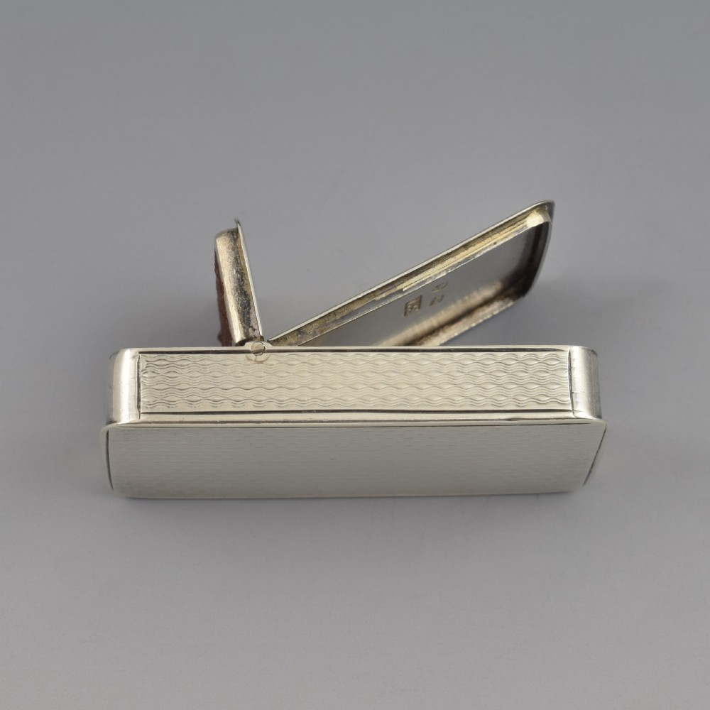 A rectangular Victorian sterling silver pocket box featuring two hinged lids, engine-turned wave engraving, and a central circular cartouche. View XIII