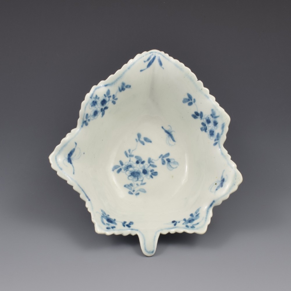 An 18th-century leaf-moulded soft-paste porcelain pickle dish with underglaze cobalt blue floral and leaf decoration. View IV