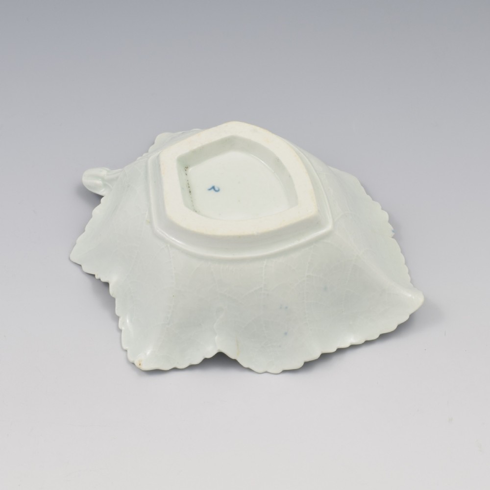 An 18th-century leaf-moulded soft-paste porcelain pickle dish with underglaze cobalt blue floral and leaf decoration. View VIII