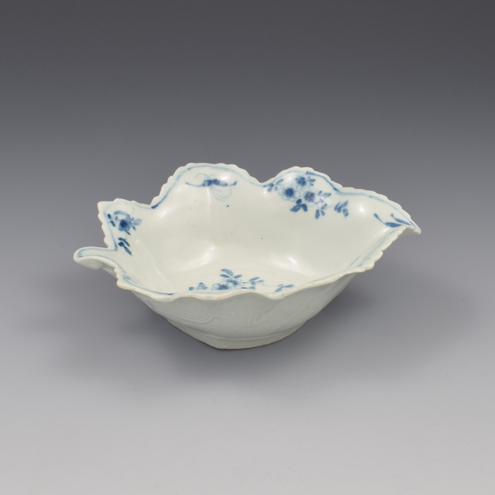 An 18th-century leaf-moulded soft-paste porcelain pickle dish with underglaze cobalt blue floral and leaf decoration. View XIII