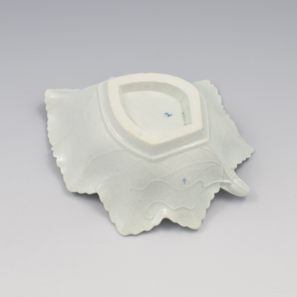 An 18th-century leaf-moulded soft-paste porcelain pickle dish with underglaze cobalt blue floral and leaf decoration. View XV