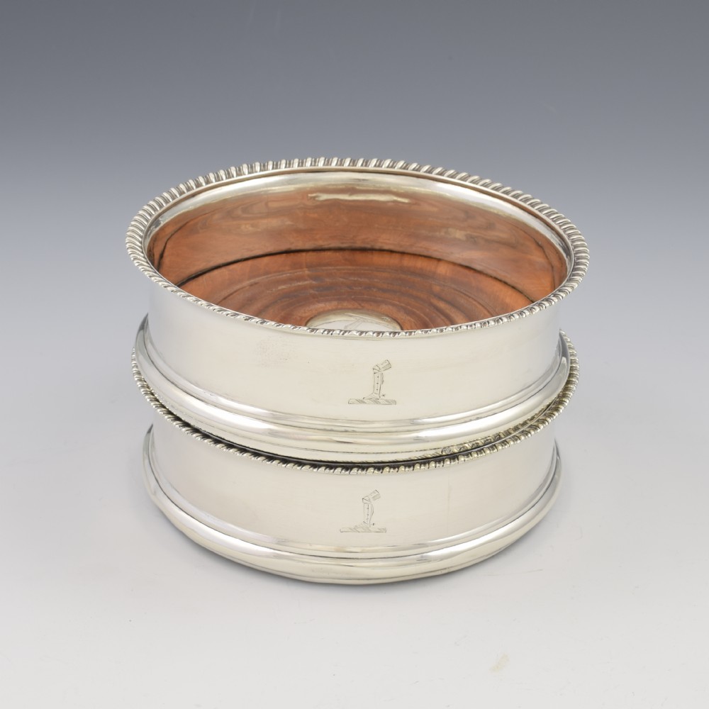 A polished sterling silver bell-shaped inkwell featuring a ring handle top, stepped base, and engraved monogram on the front. View XI