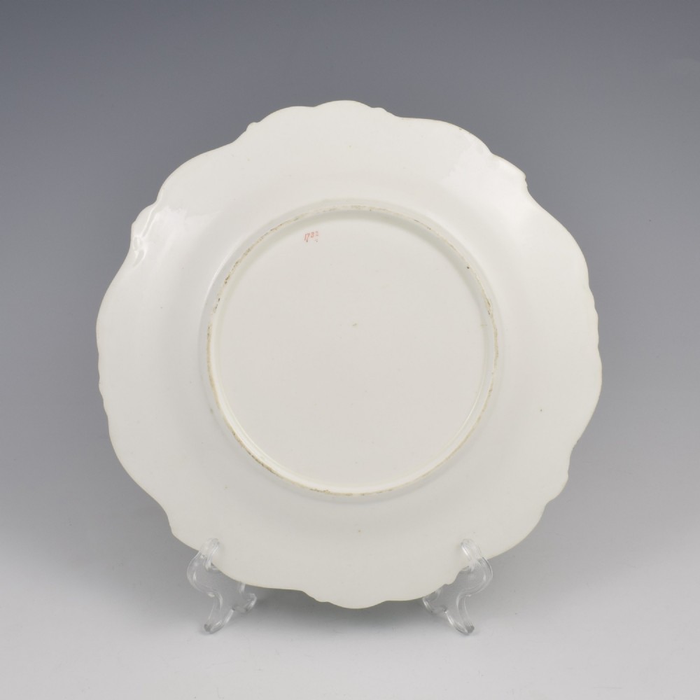 A Regency Minton porcelain dessert plate featuring a scalloped rim, broad apple green border with gilded scrolls, and a hand-painted floral bouquet at the centre. View IV