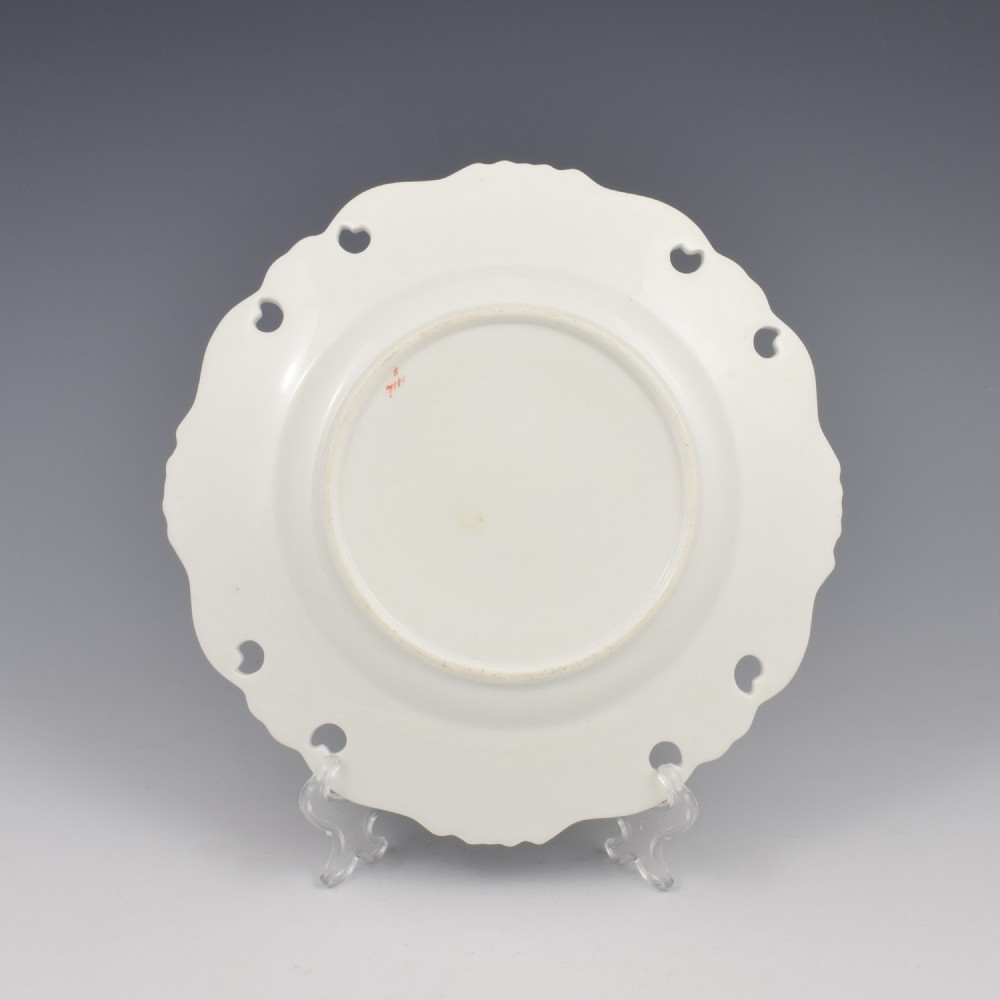 A Victorian John Ridgway porcelain dessert plate featuring a pierced duck-egg grey border with gilt scrollwork and a hand-painted central floral bouquet. View V