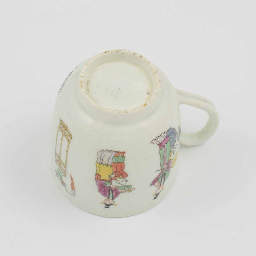 An 18th-century white porcelain coffee cup featuring a hand-painted polychrome figure scene in the Chinoiserie style with a blue patterned inner border. View VIII