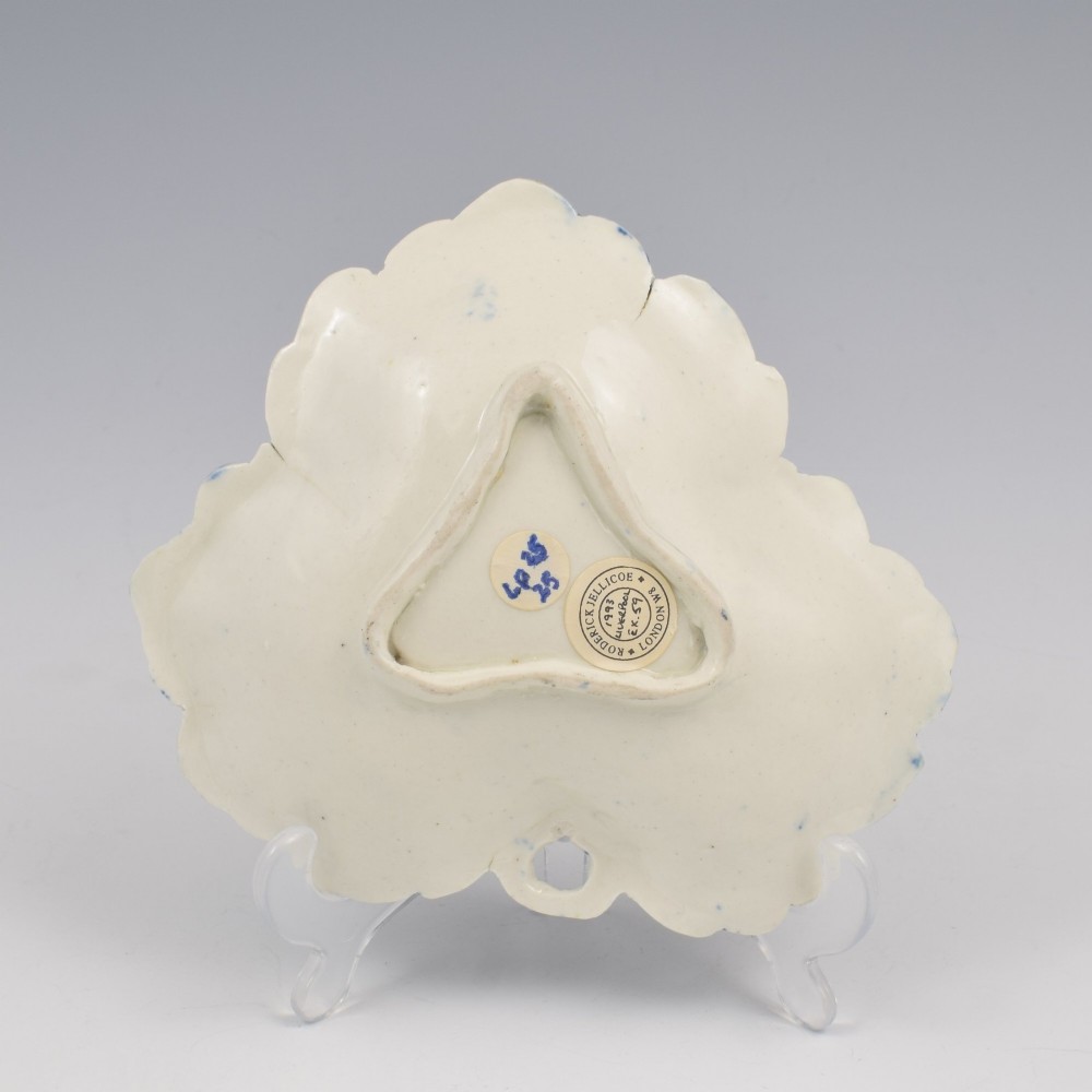 A leaf-shaped Georgian soft-paste porcelain pickle dish decorated with hand-painted underglaze blue floral motifs and a feathered edge. View VIII