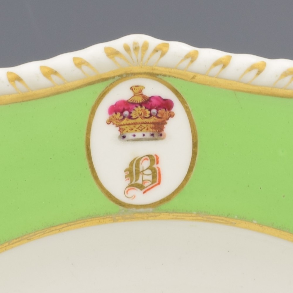 A Georgian Bloor Derby porcelain dessert plate with an apple green rim, a painted Marquess coronet crest, and a central hand-painted pink rose with insects. View III
