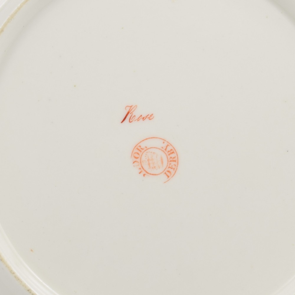 A Georgian Bloor Derby porcelain dessert plate with an apple green rim, a painted Marquess coronet crest, and a central hand-painted pink rose with insects. View VIII