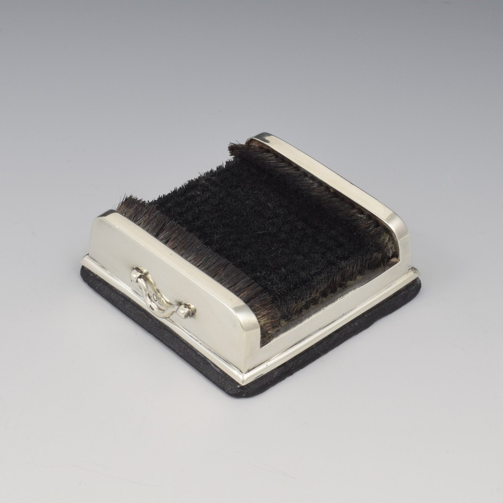 An antique Victorian sterling silver novelty pen wipe in the form of a miniature boot scraper with black bristles. View VI