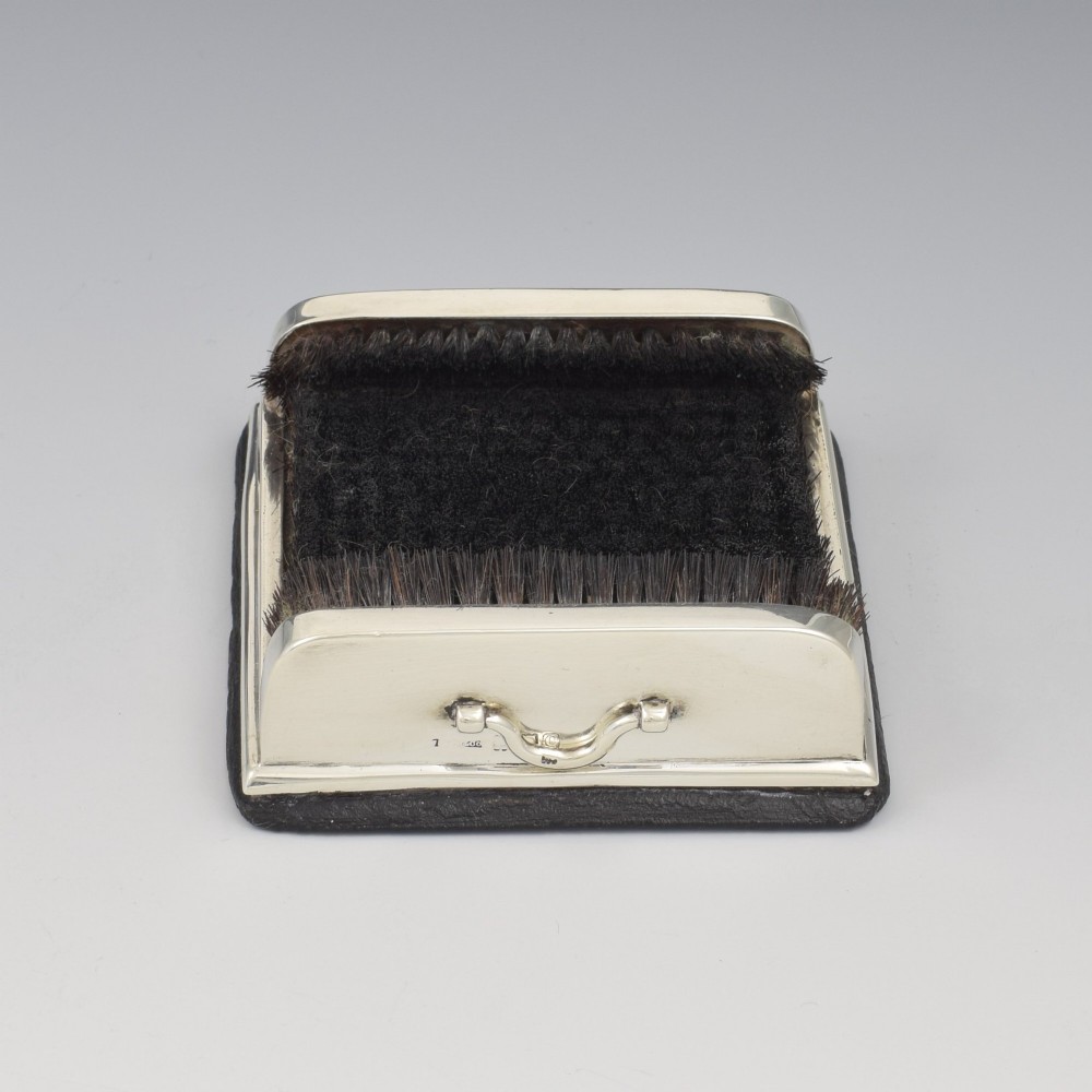 An antique Victorian sterling silver novelty pen wipe in the form of a miniature boot scraper with black bristles. View VII