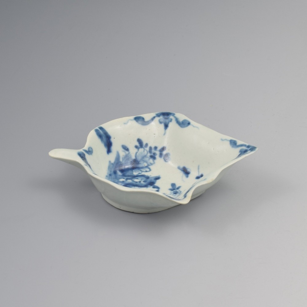 An 18th-century leaf-shaped soft-paste porcelain pickle dish featuring hand-painted chinoiserie motifs in underglaze blue. View II