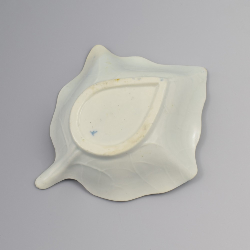 An 18th-century leaf-shaped soft-paste porcelain pickle dish featuring hand-painted chinoiserie motifs in underglaze blue. View VI