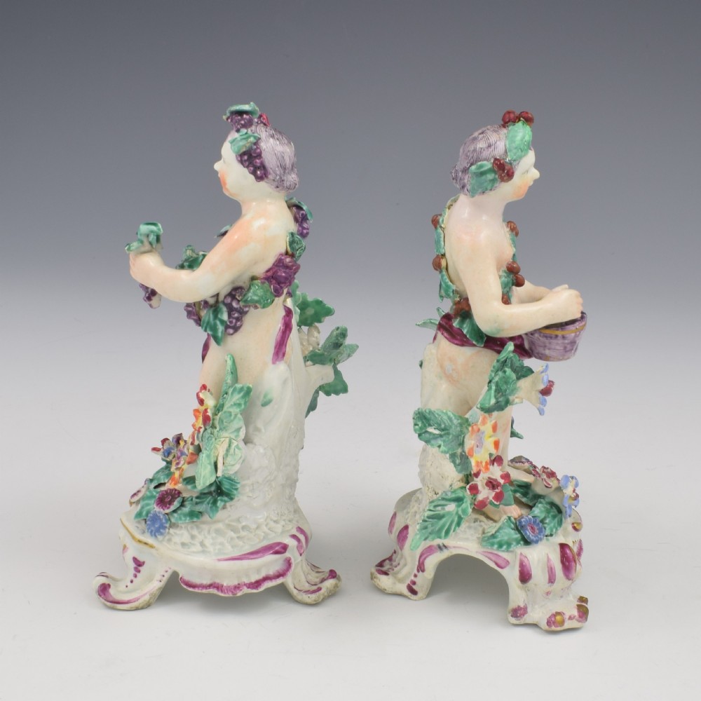 A set of four 18th-century Bow soft-paste porcelain figures representing the seasons, depicting putti on rococo scroll bases with colourful floral bocage. View VII