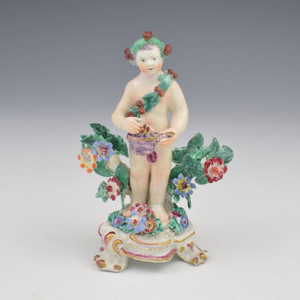 A set of four 18th-century Bow soft-paste porcelain figures representing the seasons, depicting putti on rococo scroll bases with colourful floral bocage. View XXIII