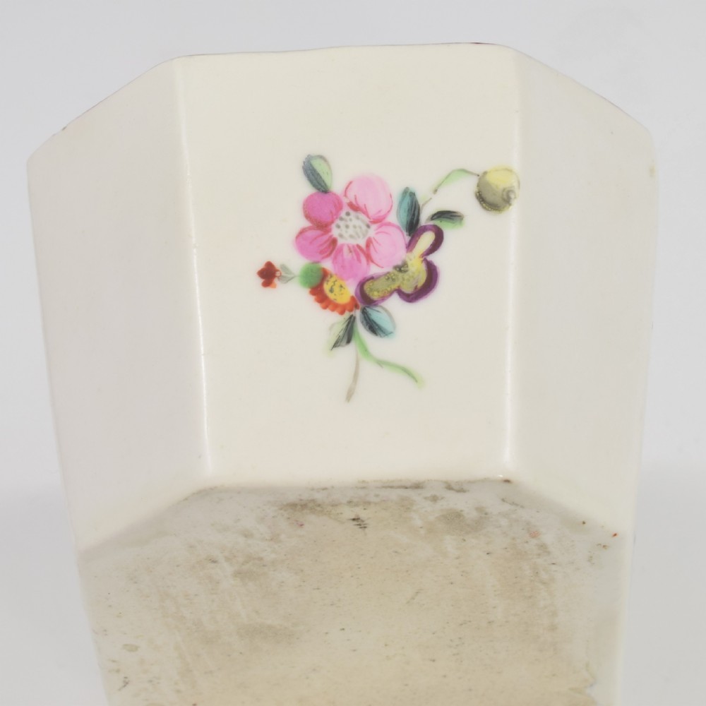 An 18th-century off-white porcelain butter tub with a fitted cover, top handle, and hand-painted floral motifs. View XXII
