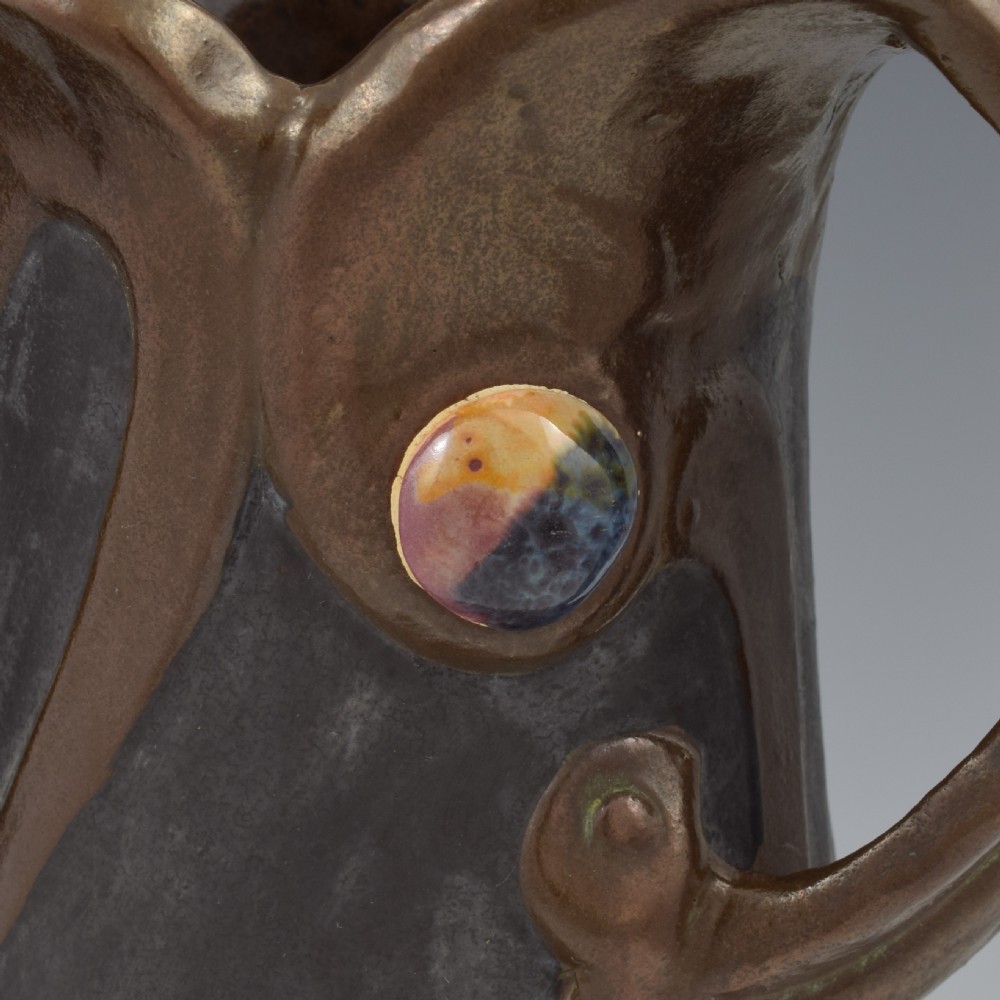 An Art Nouveau brown ceramic vase featuring a metallic copper effect surface, organic twin handles, flared rim, and inset colourful glazed cabochons. View XIII