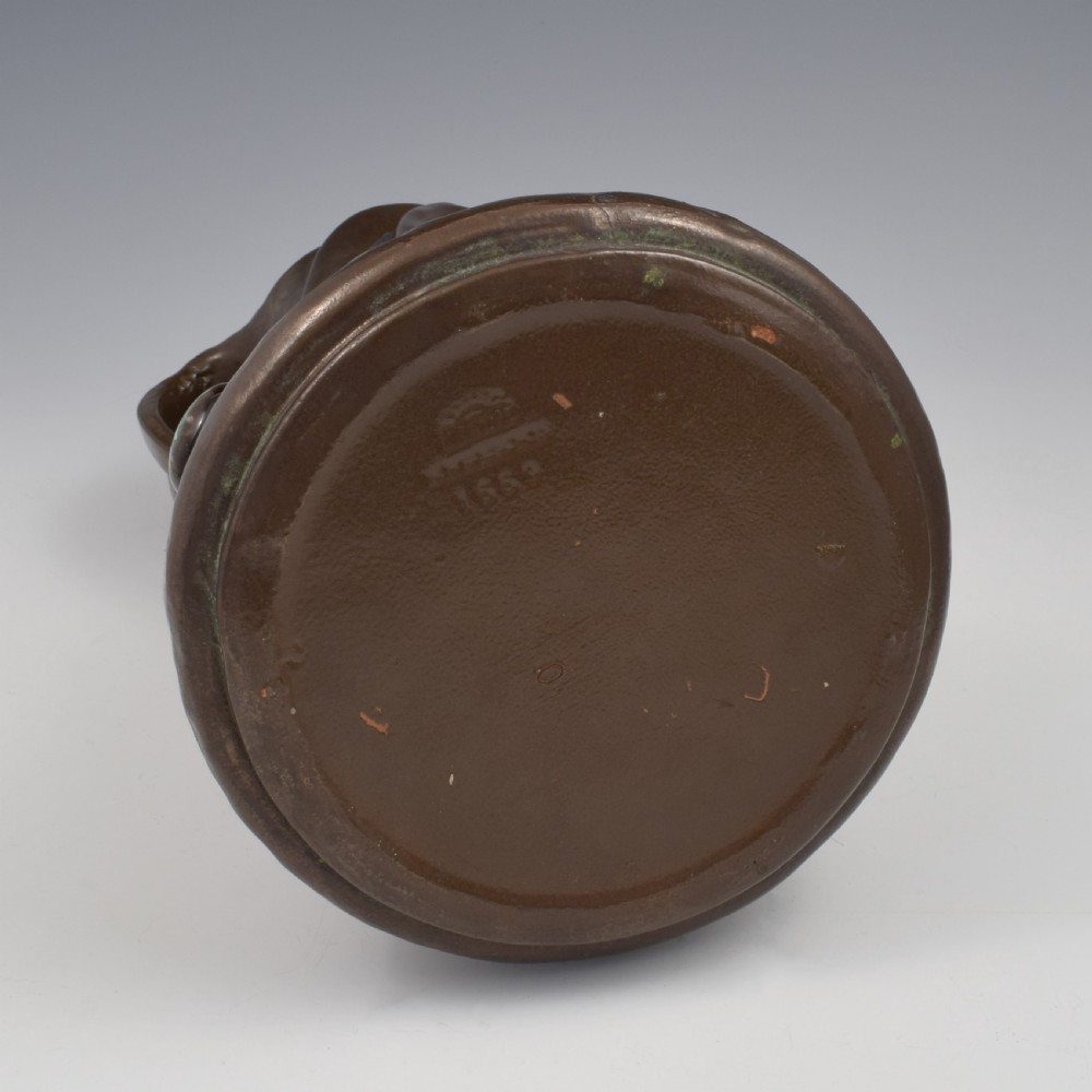 An Art Nouveau brown ceramic vase featuring a metallic copper effect surface, organic twin handles, flared rim, and inset colourful glazed cabochons. View XIV