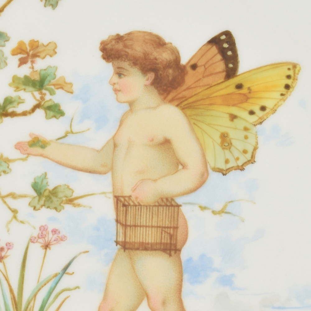 An antique round Minton porcelain cabinet plate featuring a reticulated gilt rim with turquoise trim and a hand-painted central illustration of a winged fairy near a squirrel in an oak tree. View IV