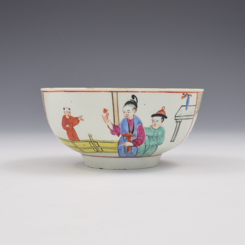 An 18th-century circular soft-paste porcelain bowl decorated with hand-painted Chinese figures in polychrome enamels.